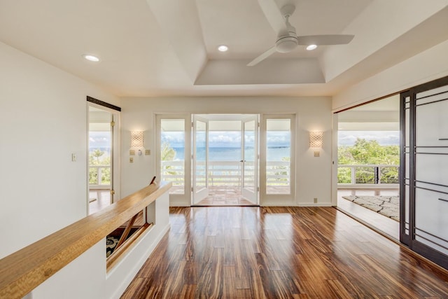 724-B Wainaku St, Hilo, HI 96720 - unfurnished room featuring wood finished floors, ceiling fan, a tray ceiling, healthy amount of natural light, and recessed lighting