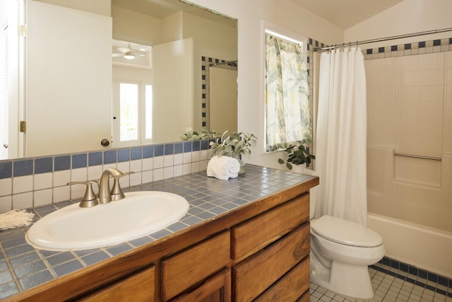 724-B Wainaku St, Hilo, HI 96720 - full bath with shower / bath combo, vanity, toilet, tile patterned floors, and a ceiling fan