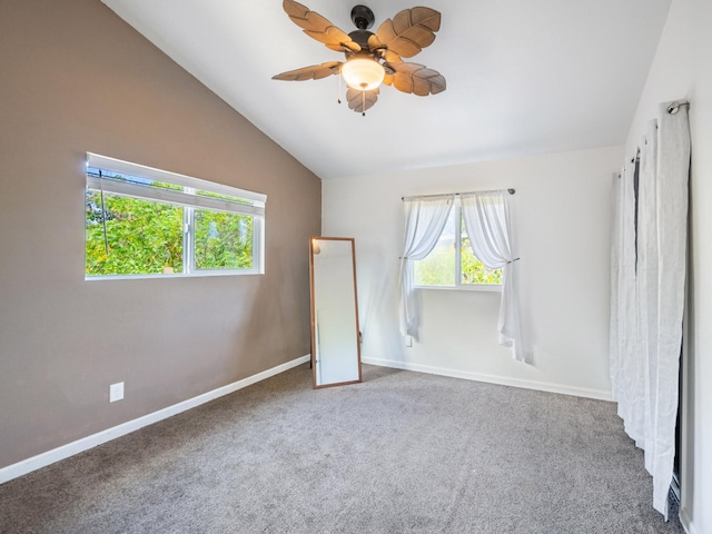 12-7038 Kehauopuna St, Pahoa, HI 96778 - unfurnished bedroom featuring vaulted ceiling, baseboards, carpet, and ceiling fan