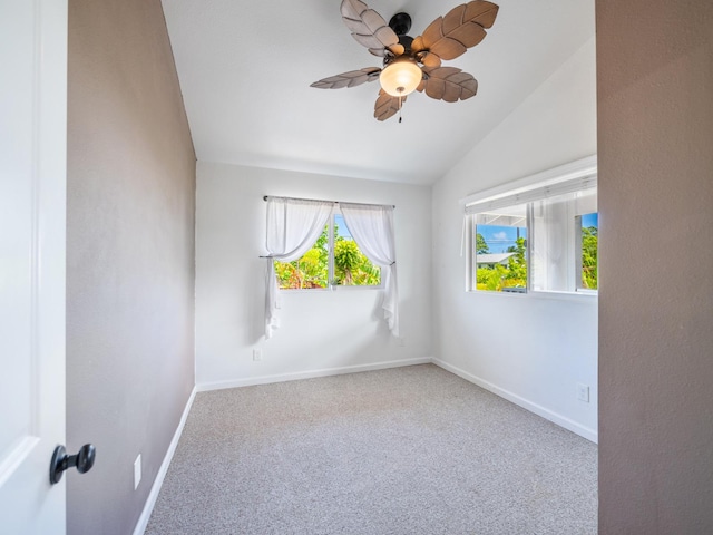 12-7038 Kehauopuna St, Pahoa, HI 96778 - carpeted empty room featuring lofted ceiling, a ceiling fan, and baseboards
