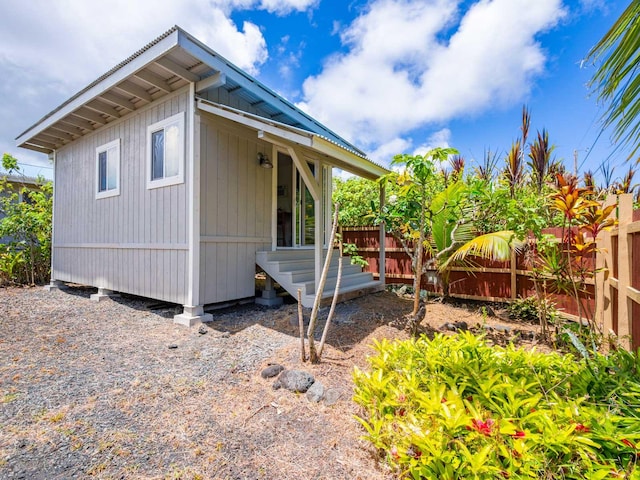 12-7038 Kehauopuna St, Pahoa, HI 96778 - view of home's exterior with metal roof
