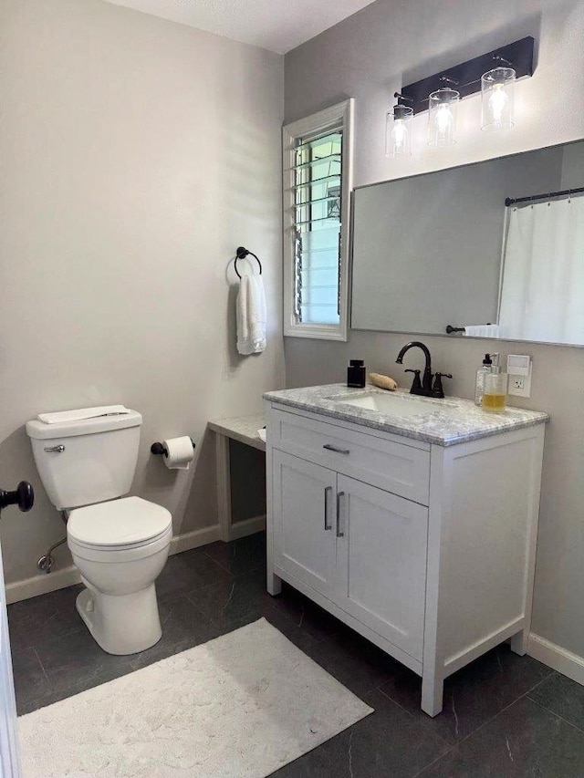 15-2694 Mano St, Pahoa, HI 96778 - bathroom featuring vanity, baseboards, and toilet
