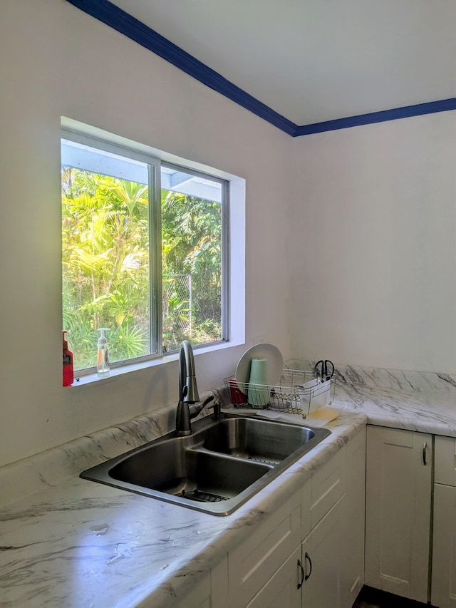 15-2714 Nenue St, Pahoa, HI 96778 - kitchen with a sink, white cabinetry, and ornamental molding