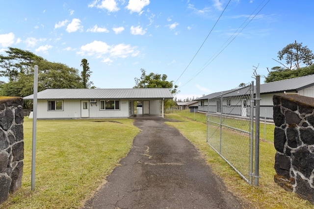 16-2095 Hibiscus Dr, Pahoa, HI 96778 - view of front of house with driveway and a metal roof