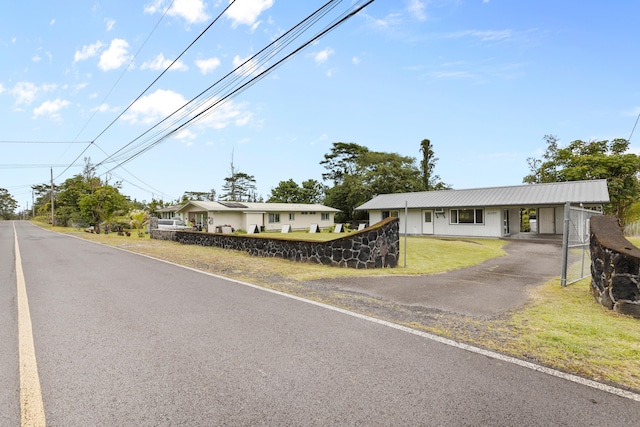 16-2095 Hibiscus Dr, Pahoa, HI 96778 - ranch-style house featuring asphalt driveway, a front lawn, and a carport