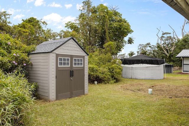 16-2095 Hibiscus Dr, Pahoa, HI 96778 - view of grassy yard featuring a shed