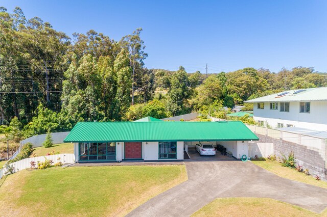 45-550 Miulana Pl, Honokaa, HI 96727 - view of front of house featuring driveway, metal roof, and an attached carport