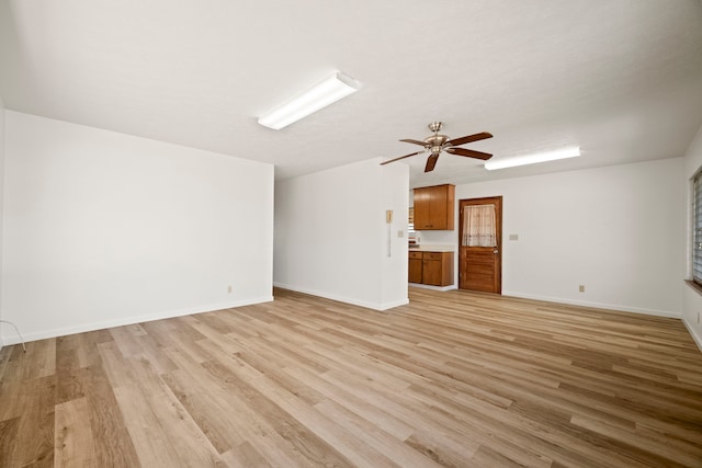 522 Aewa St, Eleele, HI 96705 - unfurnished living room with a ceiling fan and light wood-style flooring