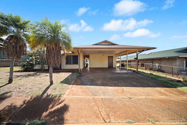 522 Aewa St, Eleele, HI 96705 - view of front facade with driveway and an attached carport