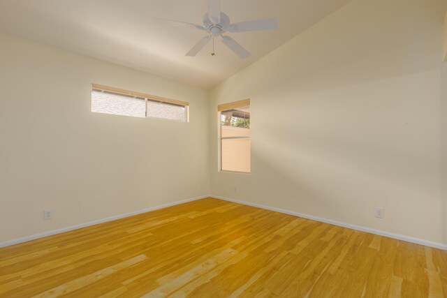 75-252 Nani Kailua Dr Unit 23, Kailua-Kona, HI 96740 - unfurnished room with light wood finished floors, baseboards, and vaulted ceiling