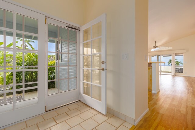 75-252 Nani Kailua Dr Unit 23, Kailua-Kona, HI 96740 - doorway with a ceiling fan, french doors, light wood finished floors, and baseboards