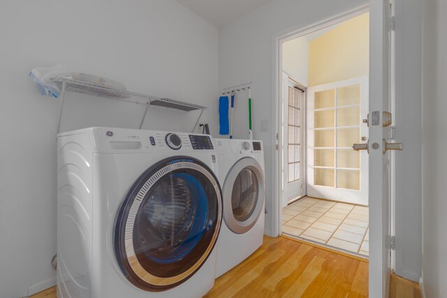 75-252 Nani Kailua Dr Unit 23, Kailua-Kona, HI 96740 - laundry area featuring washing machine and dryer and light wood finished floors