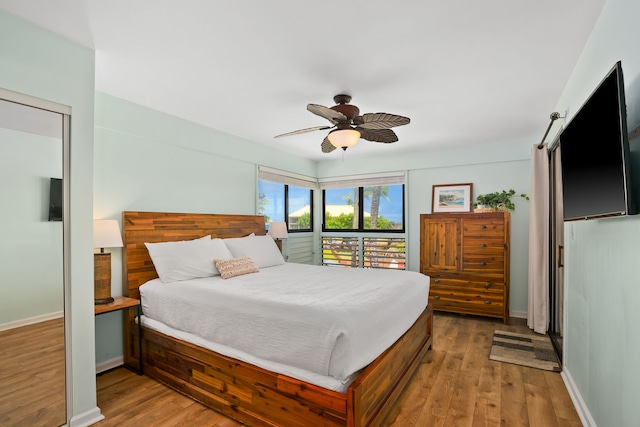 4330 Kauai Beach Dr Unit E5, Lihue, HI 96766 - bedroom featuring wood finished floors and a ceiling fan
