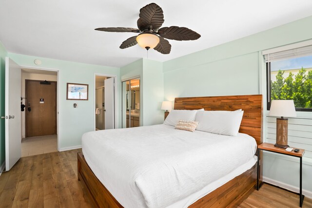 4330 Kauai Beach Dr Unit E5, Lihue, HI 96766 - bedroom featuring wood finished floors, ensuite bath, and a ceiling fan