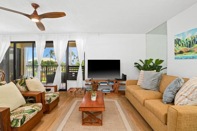 4330 Kauai Beach Dr Unit E5, Lihue, HI 96766 - living room featuring light wood-style floors and a ceiling fan