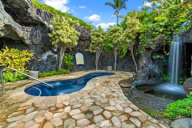 4330 Kauai Beach Dr Unit E5, Lihue, HI 96766 - outdoor pool with a patio and a small pond