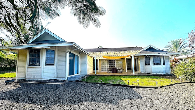 73-1276 Kaiminani Dr, Kailua-Kona, HI 96740 - back of house with a lawn