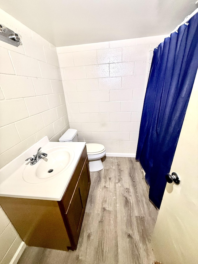 4156 Rice St Unit 306, Lihue, HI 96766 - full bathroom featuring wood finished floors, vanity, toilet, and curtained shower