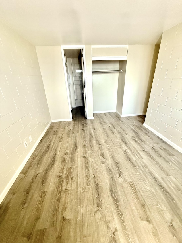 4156 Rice St Unit 306, Lihue, HI 96766 - unfurnished bedroom with wood finished floors, baseboards, and a closet