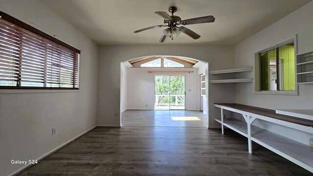 3215-C Wawae Rd, Kalaheo, HI 96741 - unfurnished dining area featuring arched walkways, ceiling fan, dark wood-style floors, and vaulted ceiling
