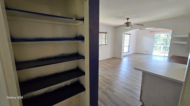 3215-C Wawae Rd, Kalaheo, HI 96741 - unfurnished living room featuring arched walkways, wood finished floors, and ceiling fan