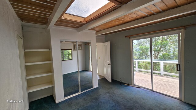 3215-C Wawae Rd, Kalaheo, HI 96741 - spare room featuring a skylight, dark colored carpet, and beam ceiling
