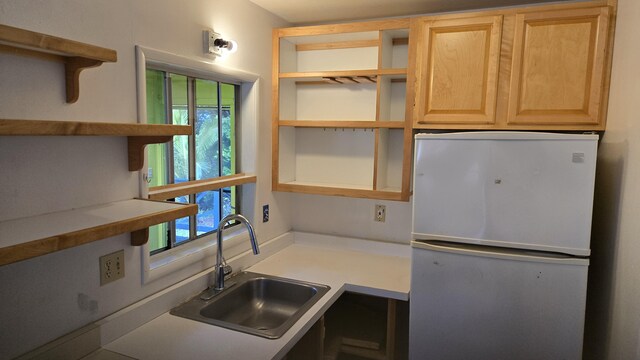 3215-C Wawae Rd, Kalaheo, HI 96741 - kitchen featuring open shelves, freestanding refrigerator, light brown cabinetry, and light countertops