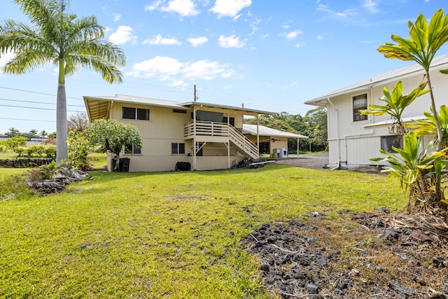 619 Mililani St, Hilo, HI 96720 - rear view of house with a yard and stairs