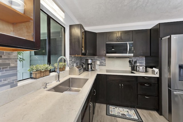 15-1925 4th Ave, Keaau, HI 96749 - kitchen featuring appliances with stainless steel finishes, decorative backsplash, crown molding, light wood finished floors, and glass insert cabinets