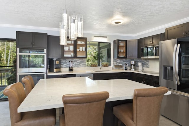 15-1925 4th Ave, Keaau, HI 96749 - kitchen featuring stainless steel appliances, ornamental molding, a textured ceiling, tasteful backsplash, and healthy amount of natural light