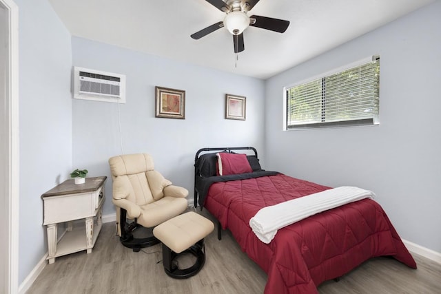 15-1925 4th Ave, Keaau, HI 96749 - bedroom featuring a wall mounted air conditioner, wood finished floors, and a ceiling fan