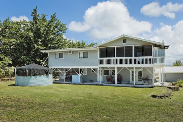 15-1925 4th Ave, Keaau, HI 96749 - rear view of house featuring a patio area, a sunroom, and a lawn