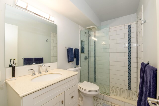 69-1647 Puako Beach Dr Unit 105, Kamuela, HI 96743 - bathroom with toilet, vanity, a tile shower, and tile patterned floors