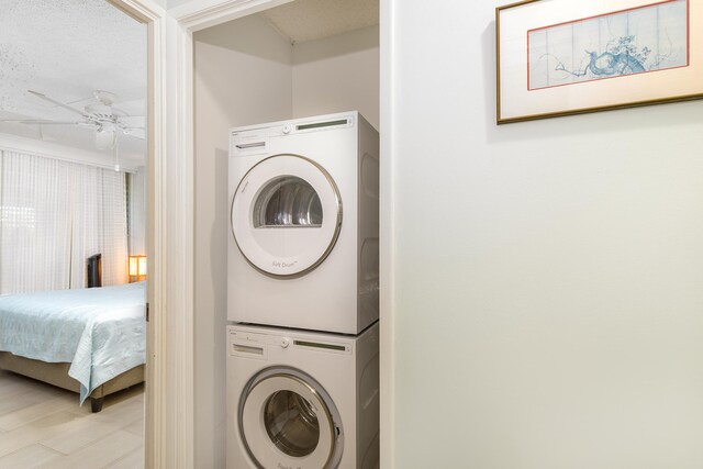 69-1647 Puako Beach Dr Unit 105, Kamuela, HI 96743 - laundry room with estacked washer and dryer and a ceiling fan