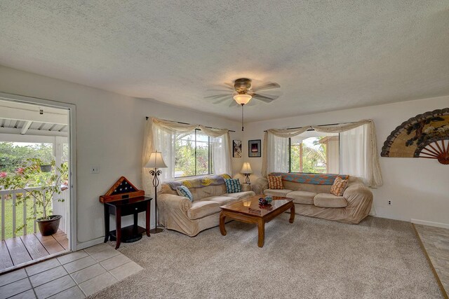 16-2038 Maile Way, Pahoa, HI 96778 - living area with ceiling fan, a textured ceiling, light carpet, and light tile patterned floors