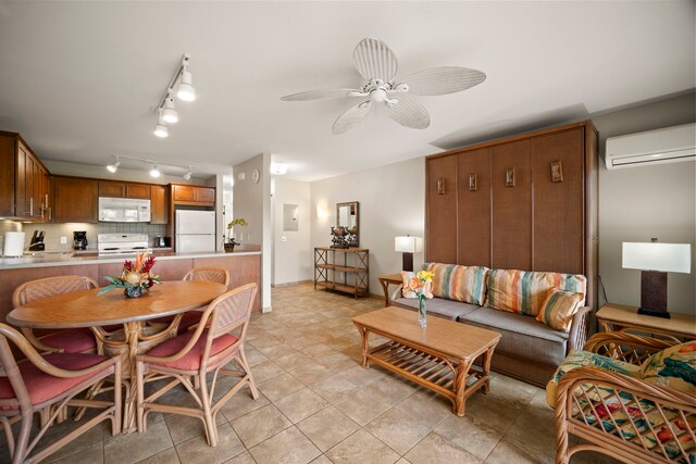 4-1250 Kuhio Hwy Unit H105, Kapaa, HI 96746 - dining space featuring a wall unit AC, ceiling fan, and rail lighting