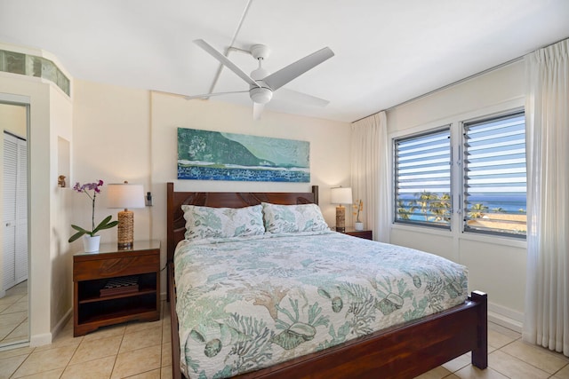 1763 Pee Rd Unit 304, Koloa, HI 96756 - bedroom with light tile patterned floors and ceiling fan