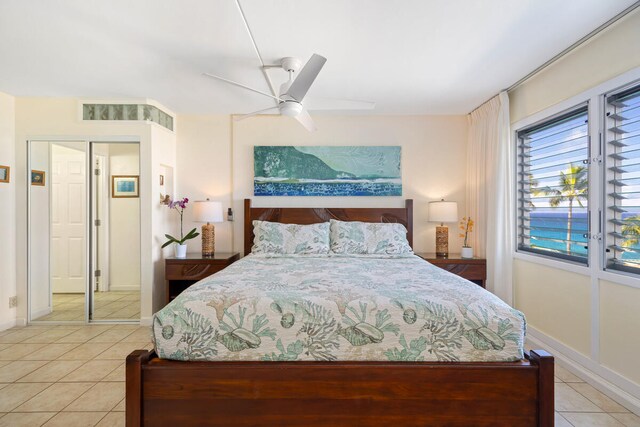 1763 Pee Rd Unit 304, Koloa, HI 96756 - bedroom featuring light tile patterned floors, ceiling fan, and baseboards