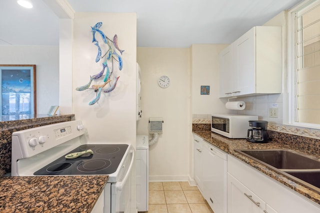 1763 Pee Rd Unit 304, Koloa, HI 96756 - kitchen with white appliances, white cabinets, light tile patterned floors, and healthy amount of natural light