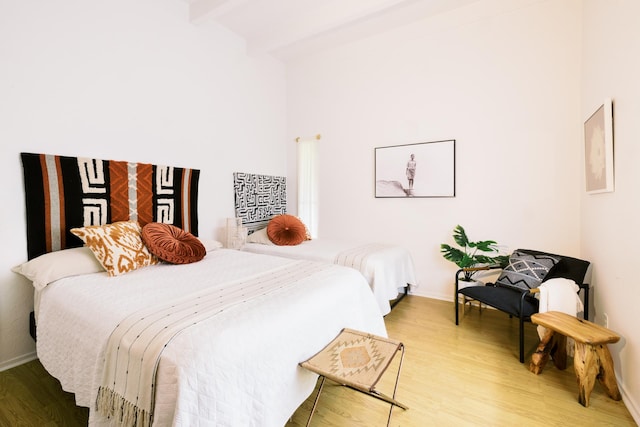 3880 Wyllie Rd Unit 5A, Princeville, HI 96722 - bedroom featuring light wood-type flooring, baseboards, and beamed ceiling