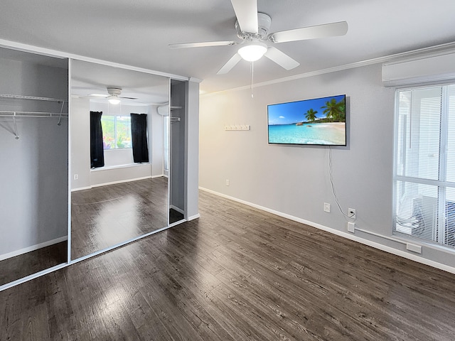 75-6081 Alii Dr Unit Dd102, Kailua-Kona, HI 96740 - unfurnished bedroom featuring wood finished floors, baseboards, ceiling fan, a wall mounted AC, and ornamental molding