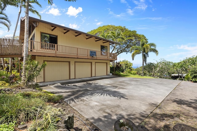 78-6737 Walua Rd, Kailua-Kona, HI 96740 - view of front of property featuring a garage, driveway, and a balcony