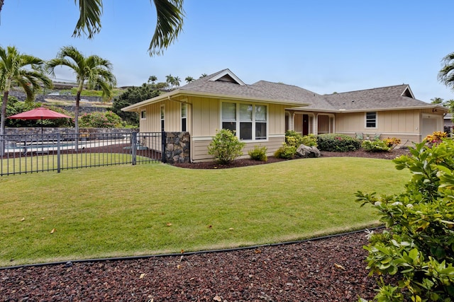 75-149 Kamilo St, Kailua-Kona, HI 96740 - view of front of house featuring board and batten siding and roof with shingles
