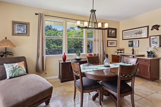 75-149 Kamilo St, Kailua-Kona, HI 96740 - dining area with a chandelier, light tile patterned floors, and baseboards
