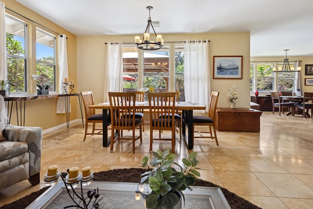 75-149 Kamilo St, Kailua-Kona, HI 96740 - dining room with a chandelier, light tile patterned floors, and baseboards