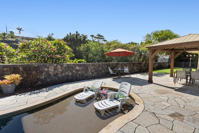 75-149 Kamilo St, Kailua-Kona, HI 96740 - view of patio / terrace featuring outdoor dining space and a gazebo