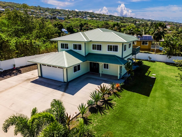 76-6347 Kupuna St, Kailua-Kona, HI 96740 - view of front of home featuring metal roof, driveway, an attached garage, and view of scattered trees