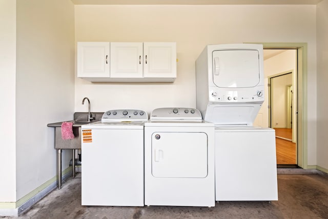 76-6347 Kupuna St, Kailua-Kona, HI 96740 - washroom featuring cabinet space, stacked washer / drying machine, baseboards, and separate washer and dryer
