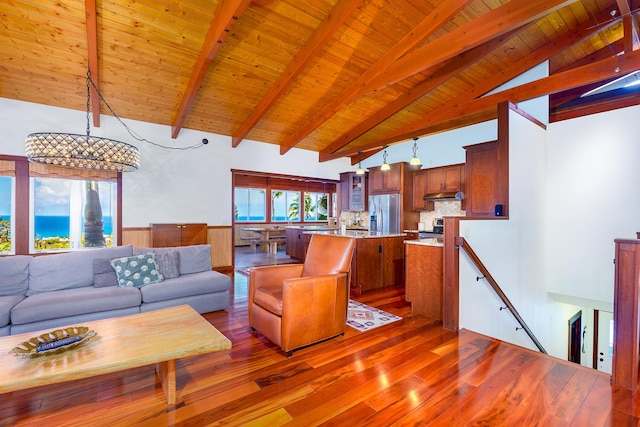 76-6319 Leone St, Kailua-Kona, HI 96740 - living area with hardwood / wood-style floors, wooden ceiling with exposed beams, wainscoting, high vaulted ceiling, and a chandelier
