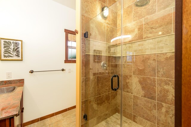 76-6319 Leone St, Kailua-Kona, HI 96740 - full bathroom featuring a stall shower, vanity, and baseboards